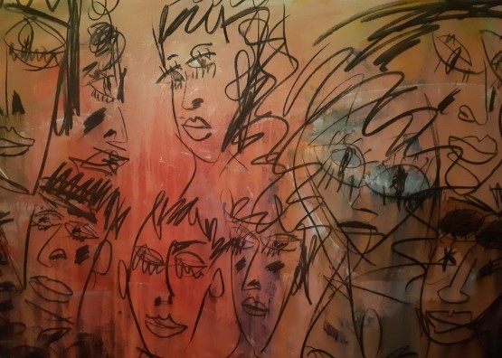 Porthcawl Artist Philip Vaughan Painting of a Red Background With Many Faces Drawn On It - 'At the Pary'